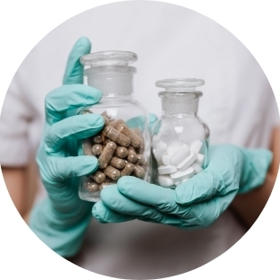 person holding jars of pills